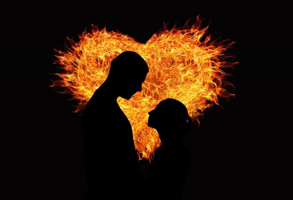 man and woman silhouette  against a glowing heart representing new heart and new spirit