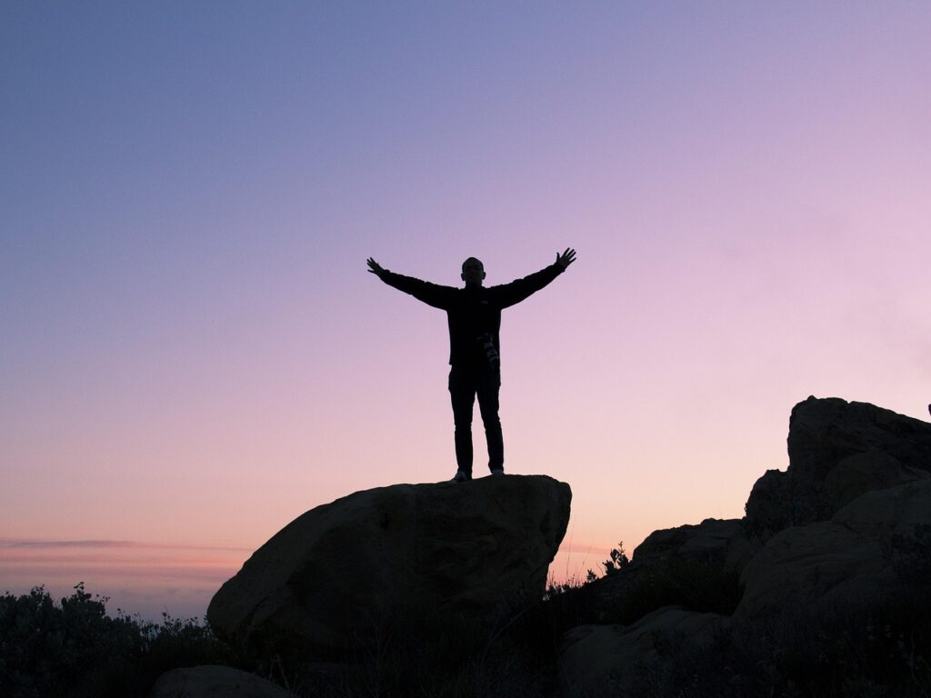 Man standing on solid rock foundation with Bible – what is your life built on