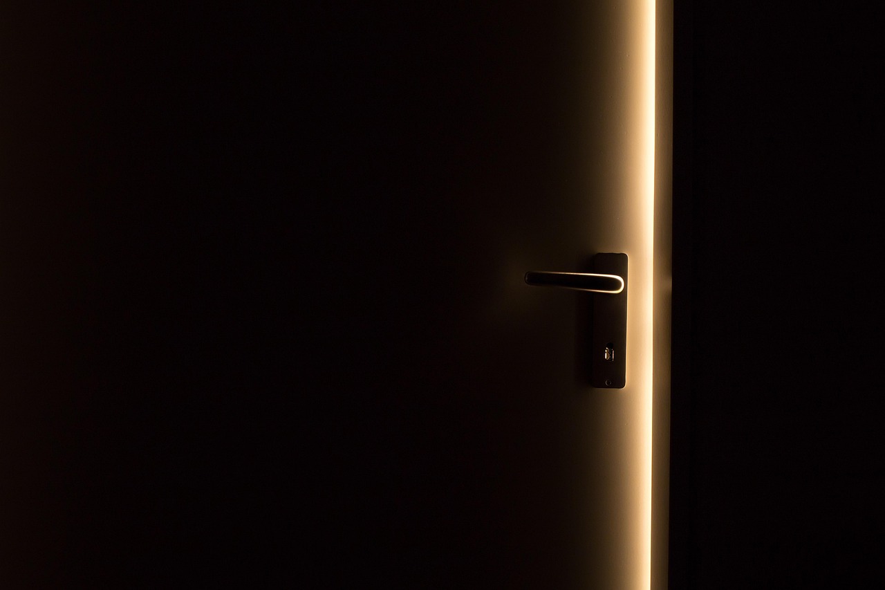 A symbolic image of an open door bathed in warm light, representing Jesus' timeless invitation to "Come unto Me."