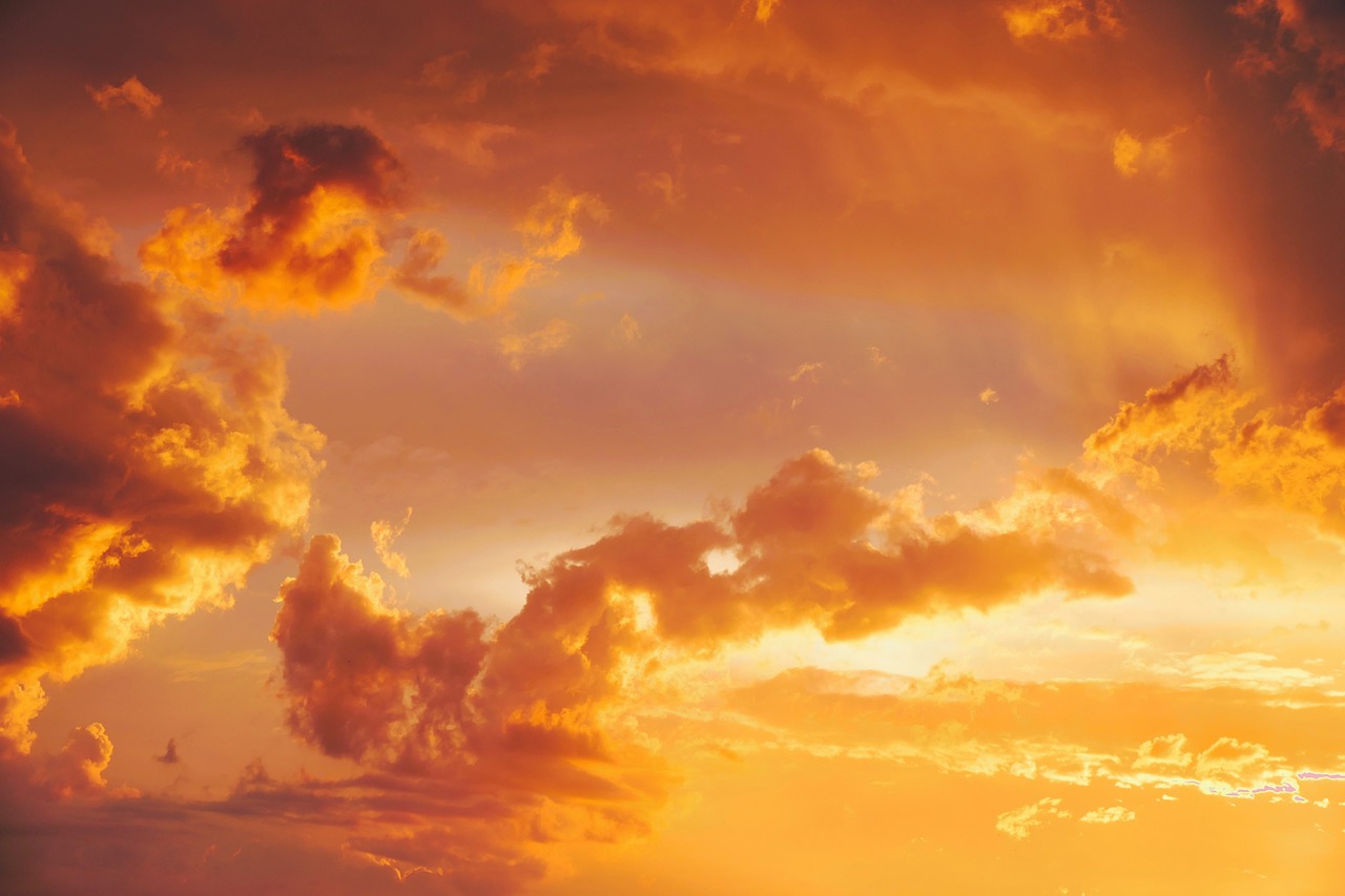 A glowing sunrise breaking through clouds, symbolizing the return of Jesus Christ