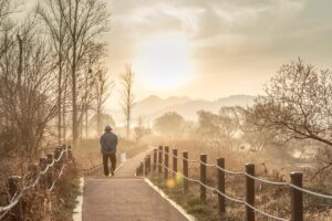 Christian walking at sunrise, symbolizing waiting for eternal reward
