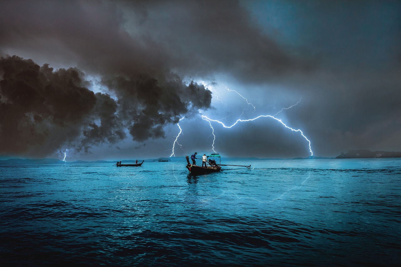 A small fishing boat rocking on stormy waters under a dark sky, with light breaking through—symbolizing Jesus in your boat