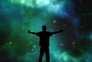 A symbolic image of a person raising hands to the sky with light shining down, representing surrender to the Holy Spirit and asking “Who is in control?”