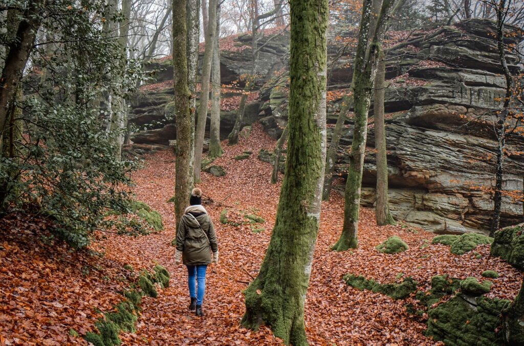 Person walking by faith across a mountain trail – symbolic of God's big game