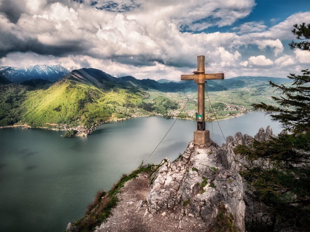 Cross resting on rock symbolizing firm foundation in Christ