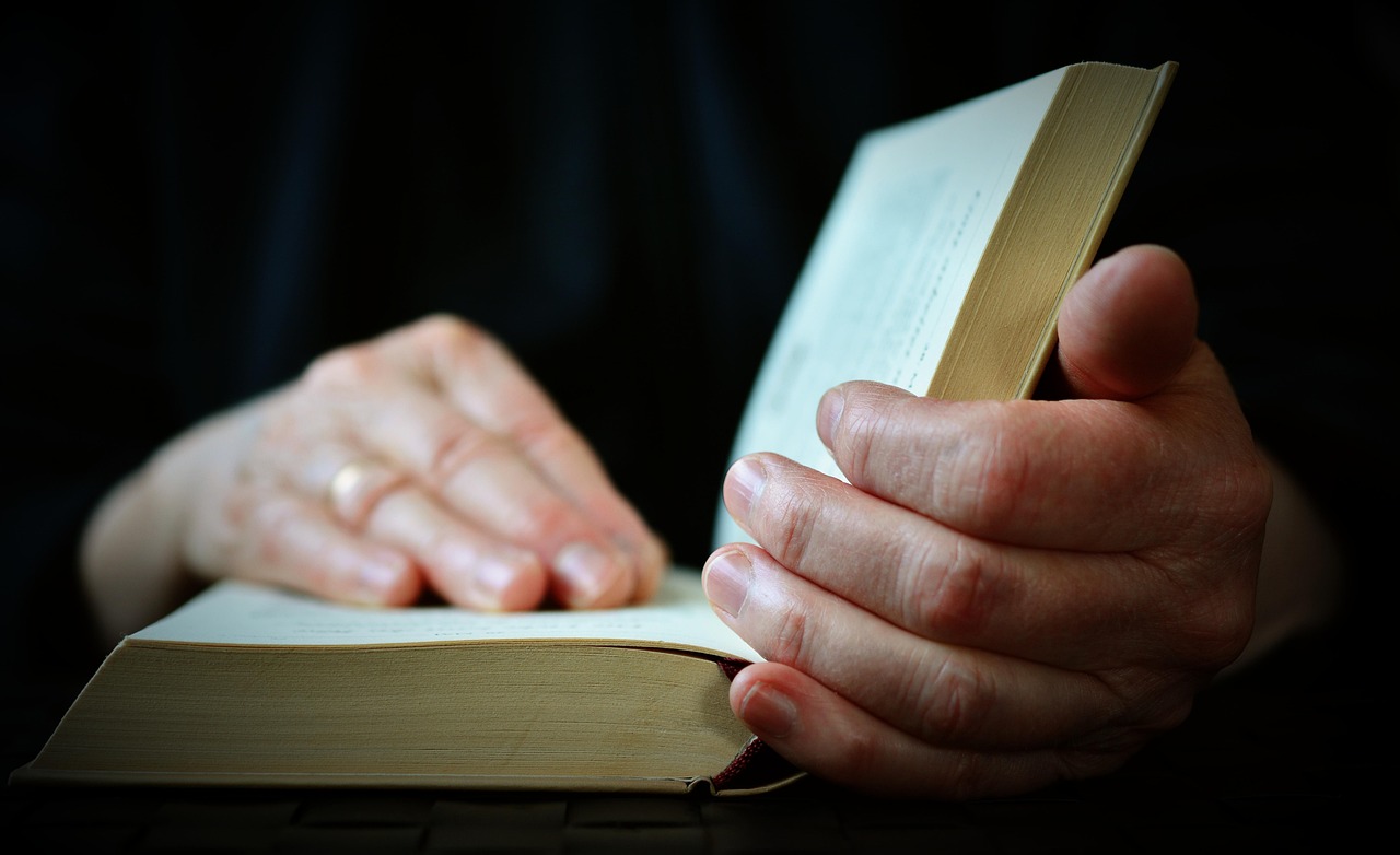 Open Bible with hands — Judging with righteous judgment