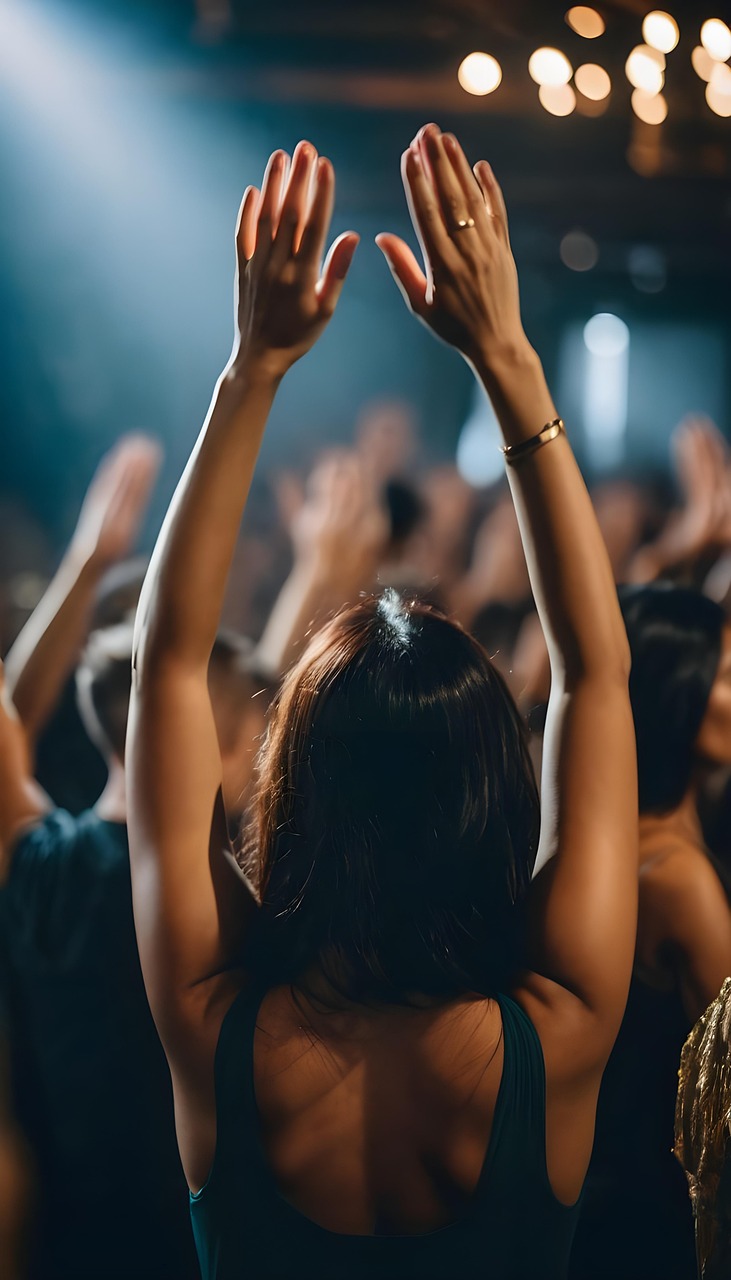 Hands raised in blessing and prayer