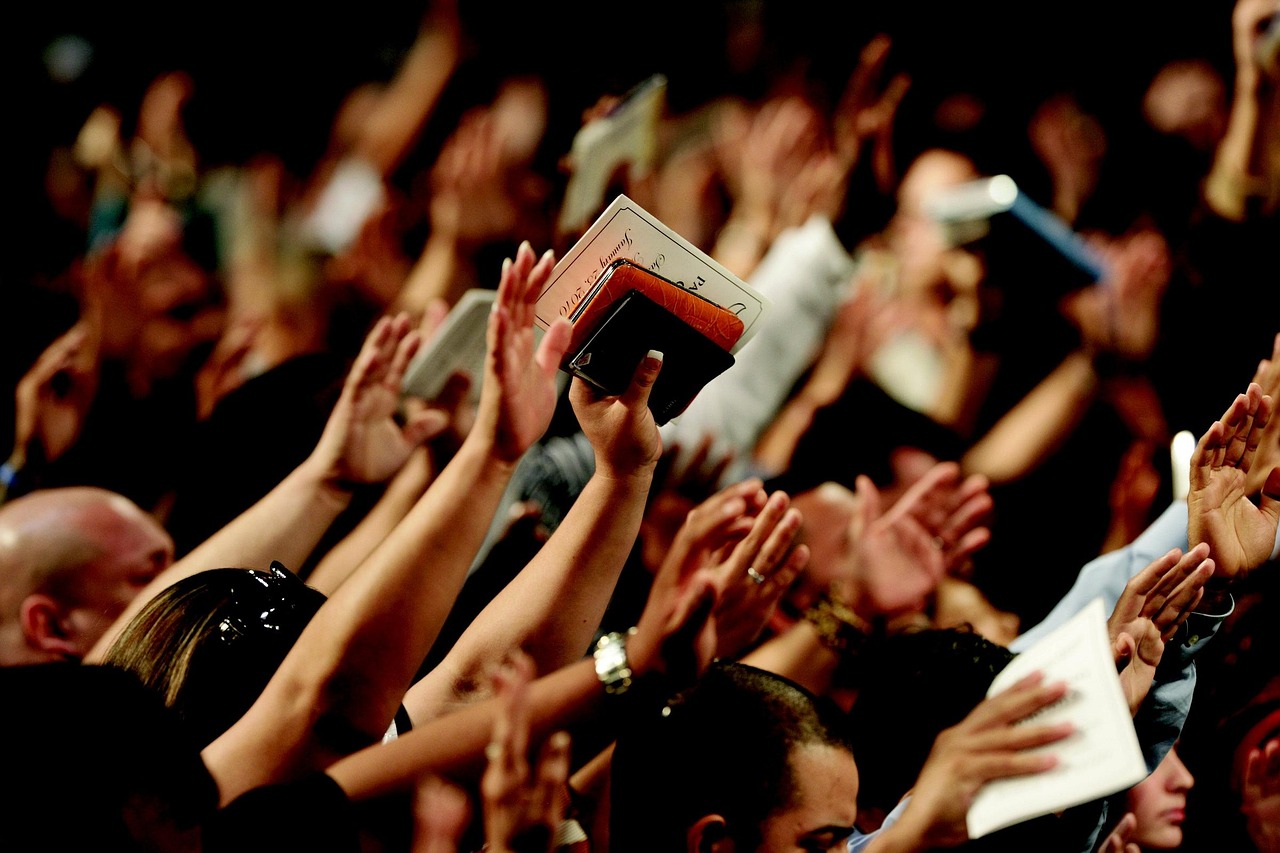 Congregation singing hymns in worship