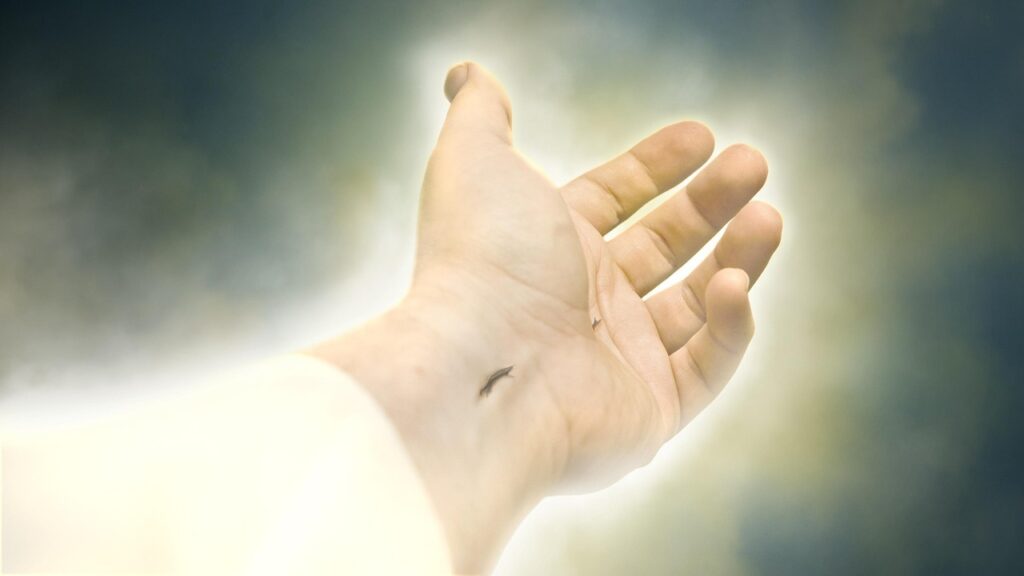 Nail-scarred hands of the risen Jesus symbolizing redemption and eternal hope