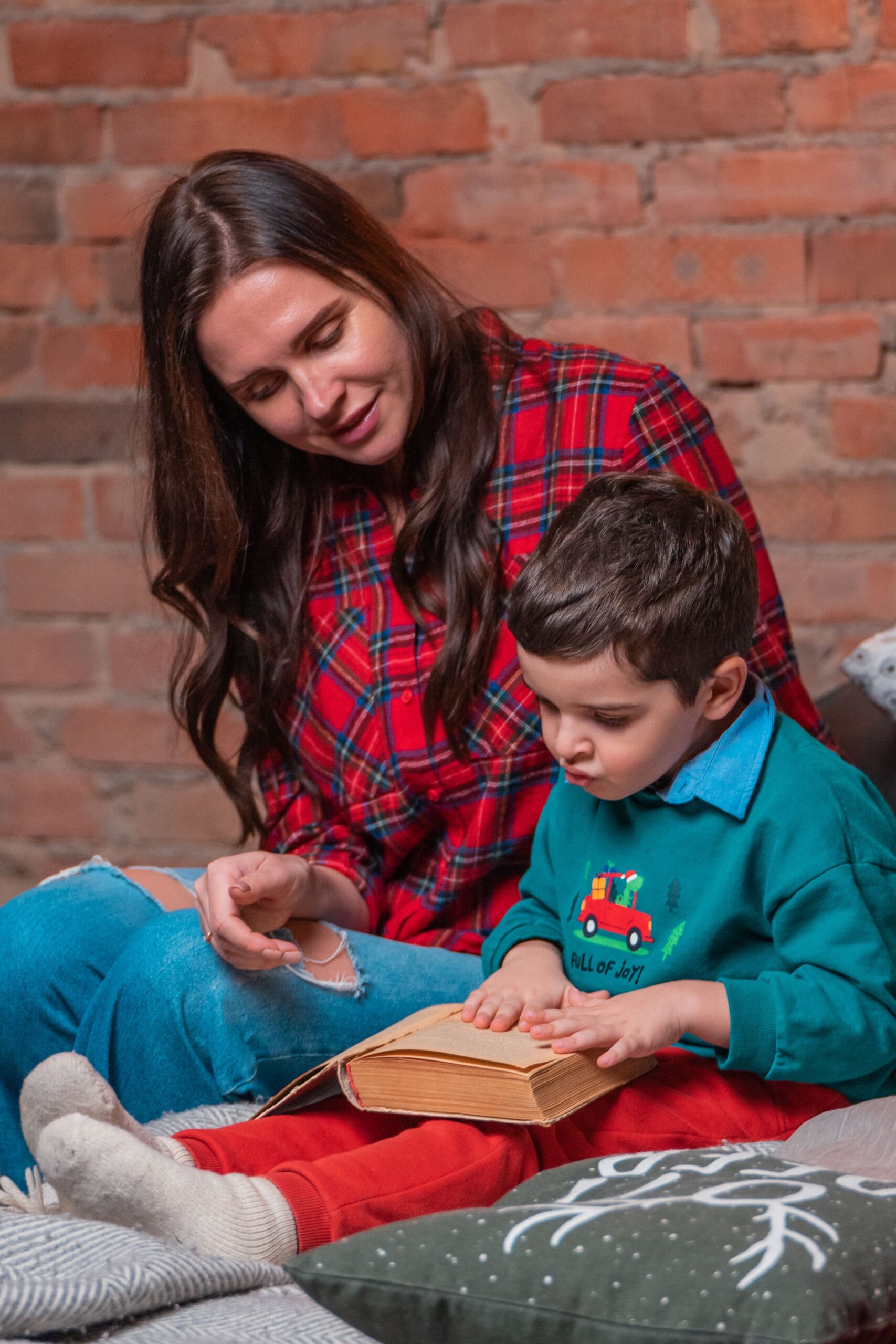 A mother gently teaching her child Scripture at home