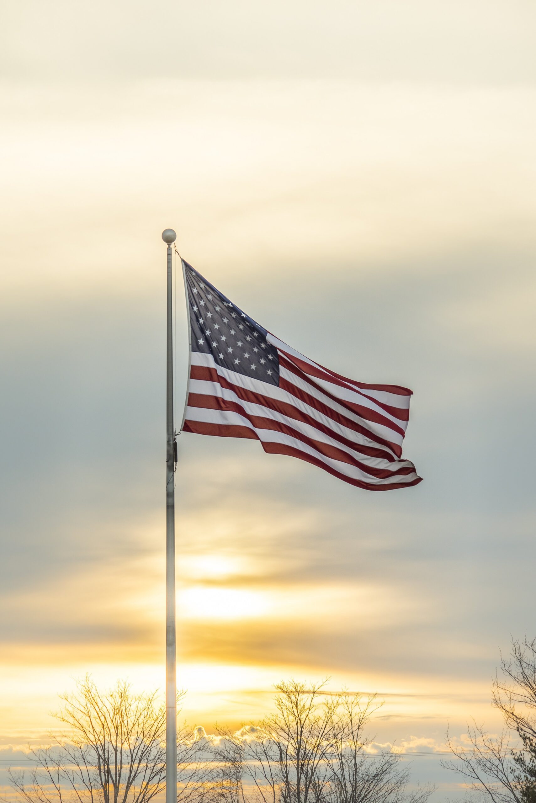 American Flag at sunrise symbolizing God Bless America