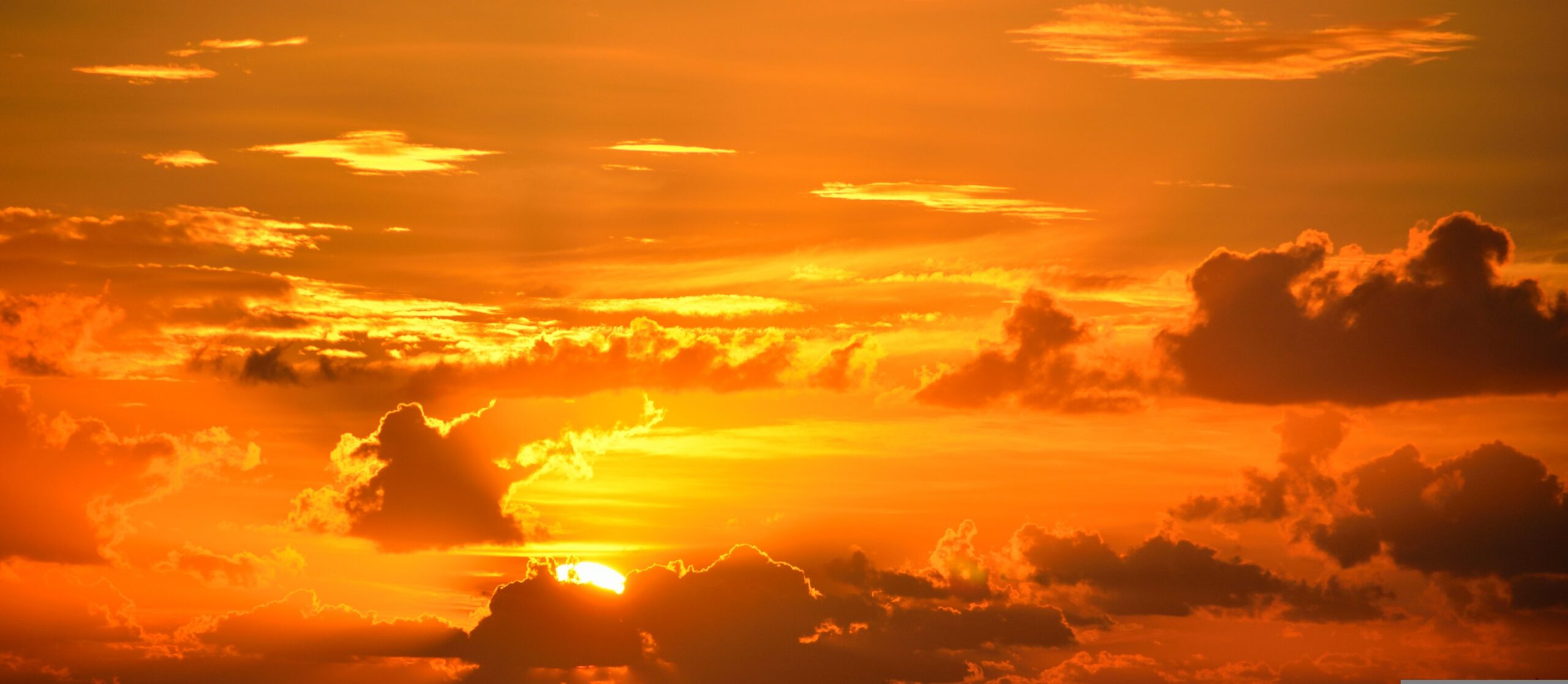 Sunrise breaking through dark clouds, symbolizing God's new mercies every morning and His unfailing faithfulness.