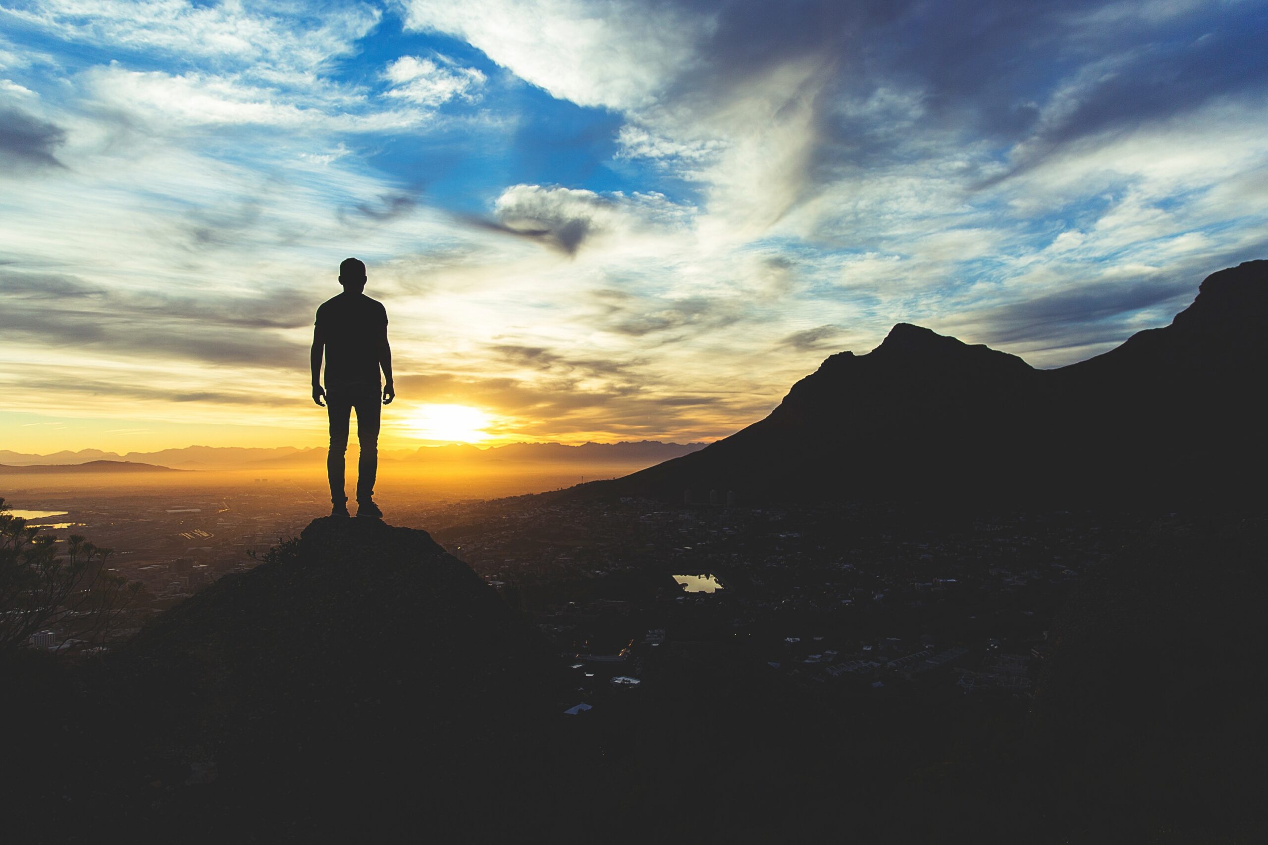 A lone believer standing before a mountain sunrise, symbolizing integrity, authentic Christian character, and a heart fully known by God.