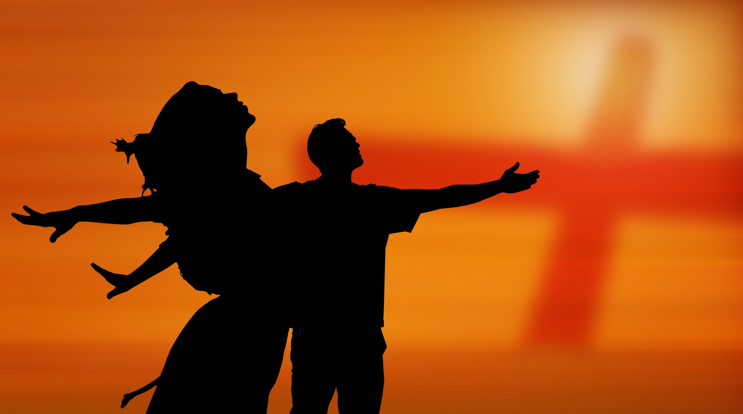 Cross silhouetted against a sunrise representing faith and trust in Jesus.
