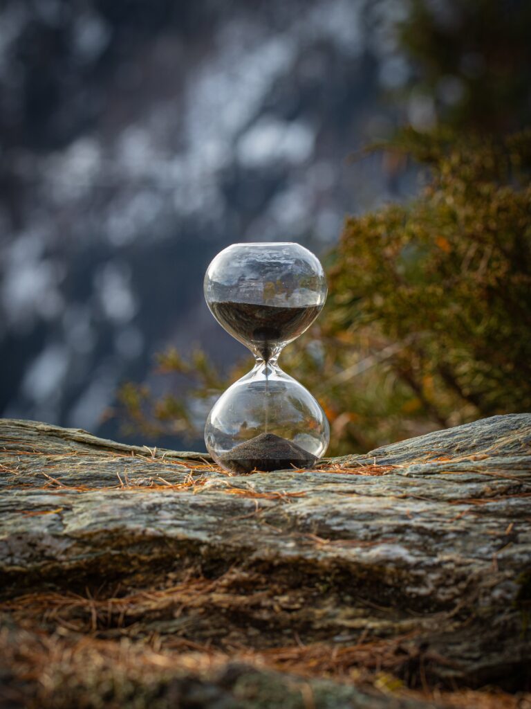 An Hour Glass catching sunlight, symbolizing how precious and fragile life is