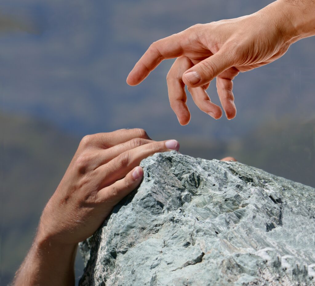 A helping hand reaching down to lift a fallen person, symbolizing how Jesus picks us up when we fall